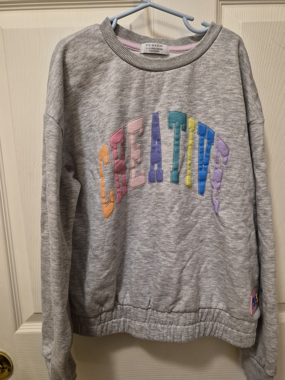 Primark Grey Sweatshirt with Multicolor 'CREATIVE' Applique